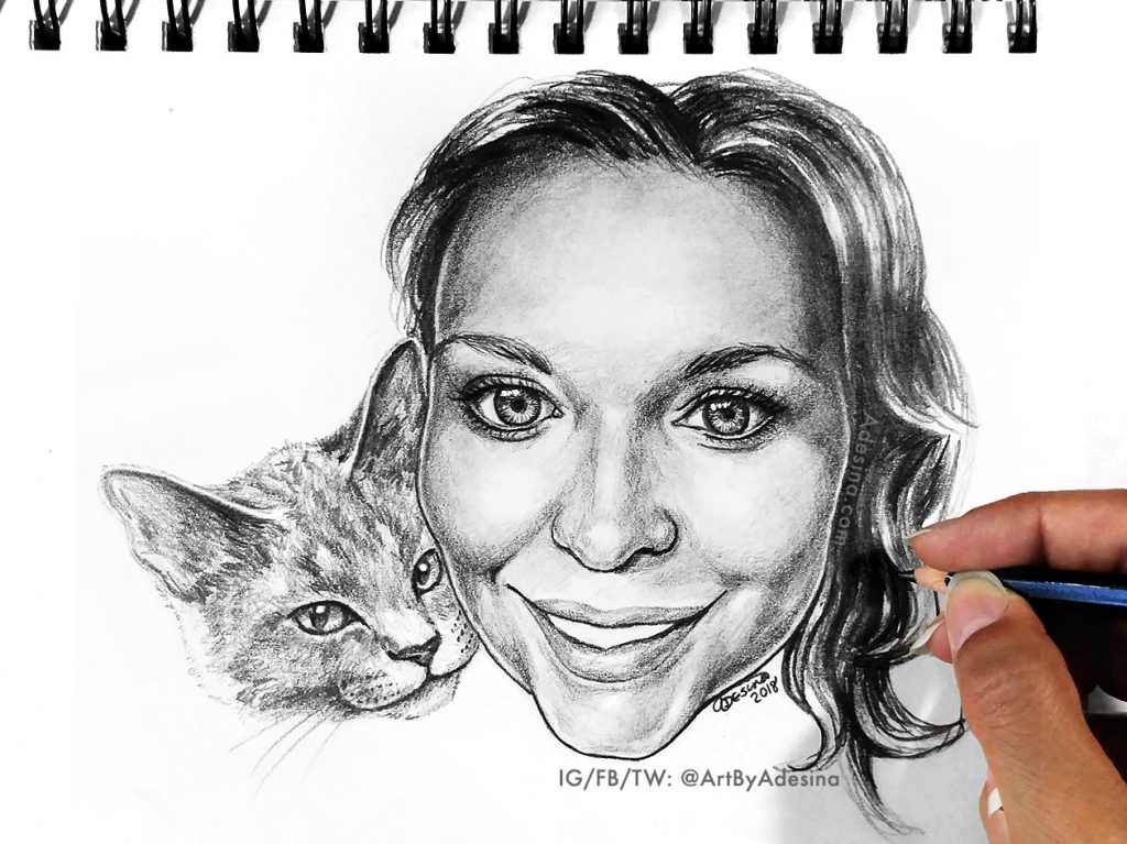 photo of a drawing by Adesina, artist, of a girl and her cat