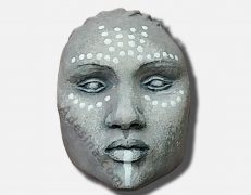 Photo of Wakanda Mini, a ceramic head sculpted by artist Adesina Sanchez