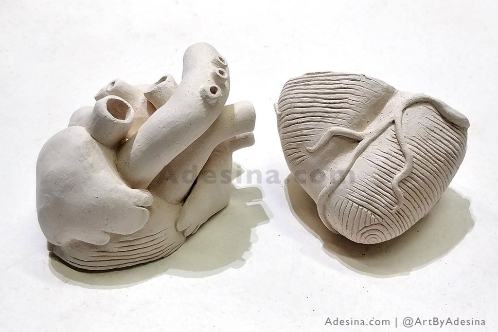 Photo of ceramic heart sculpture by Artist Adesina Sanchez