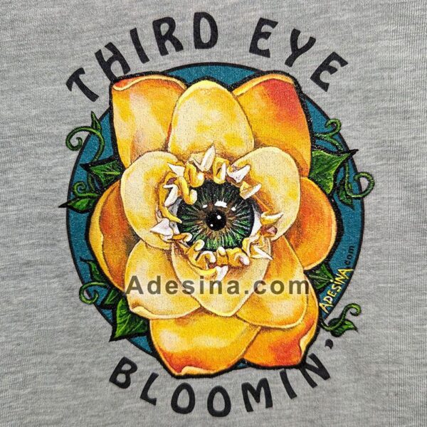 close-up photo of hand-painted artwork on Artist Adesina's Third Eye Bloomin custom tee shirt.